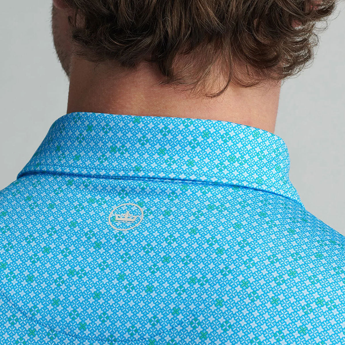 close up of the Peter Millar logo on the back of the neck area