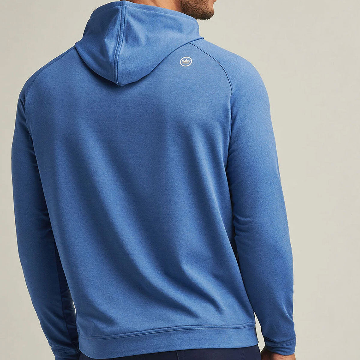 Model showing the back of the hoodie. Peter Millar logo on top right shoulder