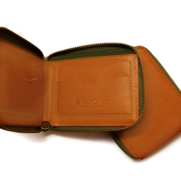 wallet shown unzipped showing the Red Canoe logo.