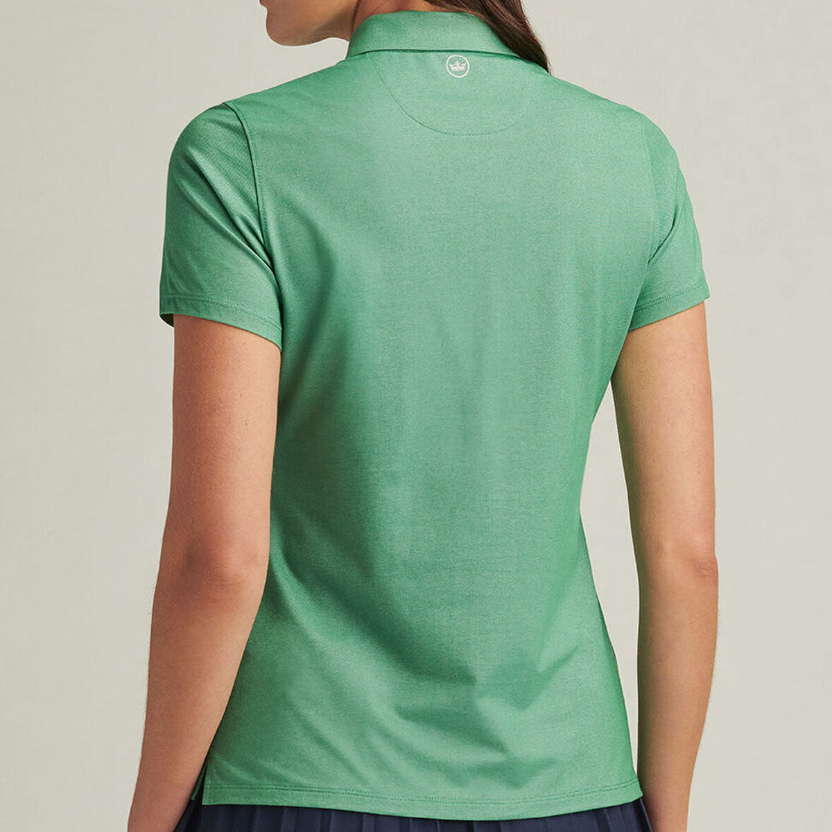 model wearing the polo showing the back