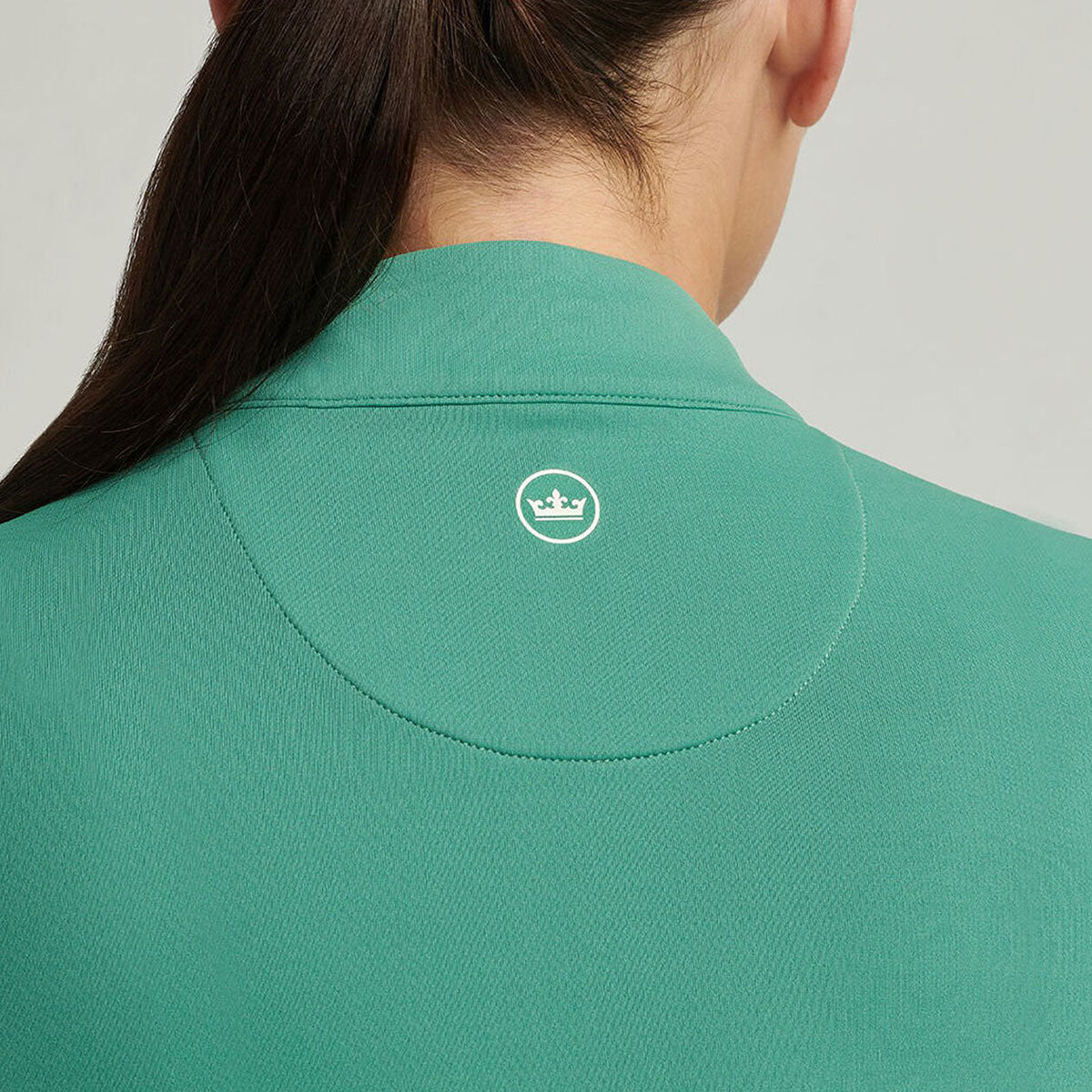 close-up of the Peter Millar logo on the back of the next area.