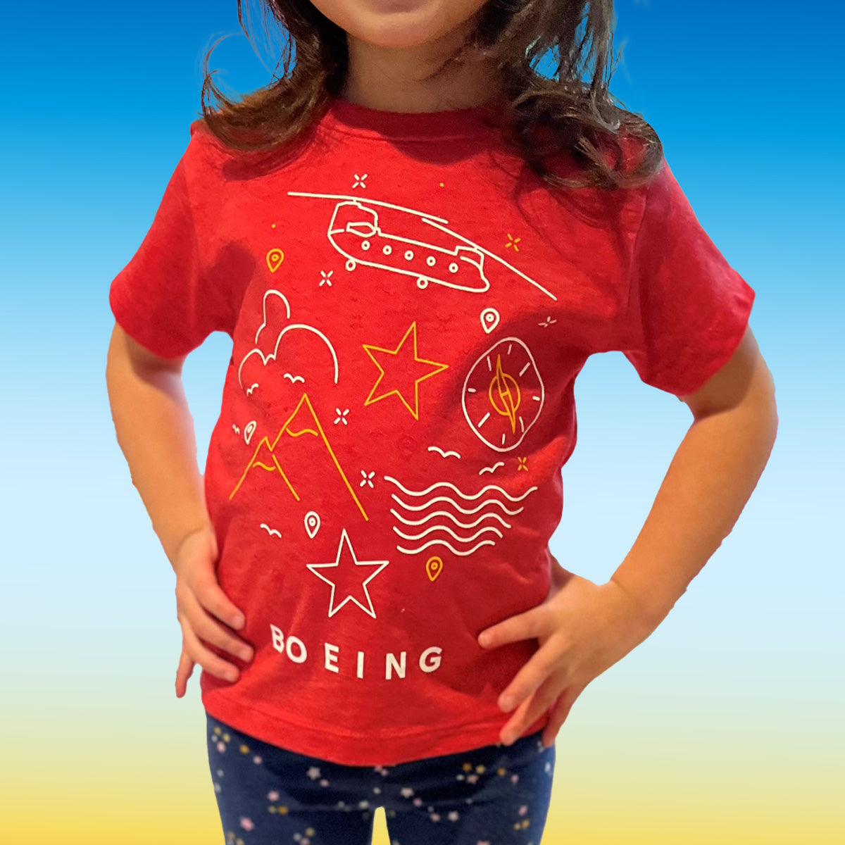 Lifestyle of Boeing Kids Graphic Tee in Red on Small Mosaic Tile in Fan Favorites