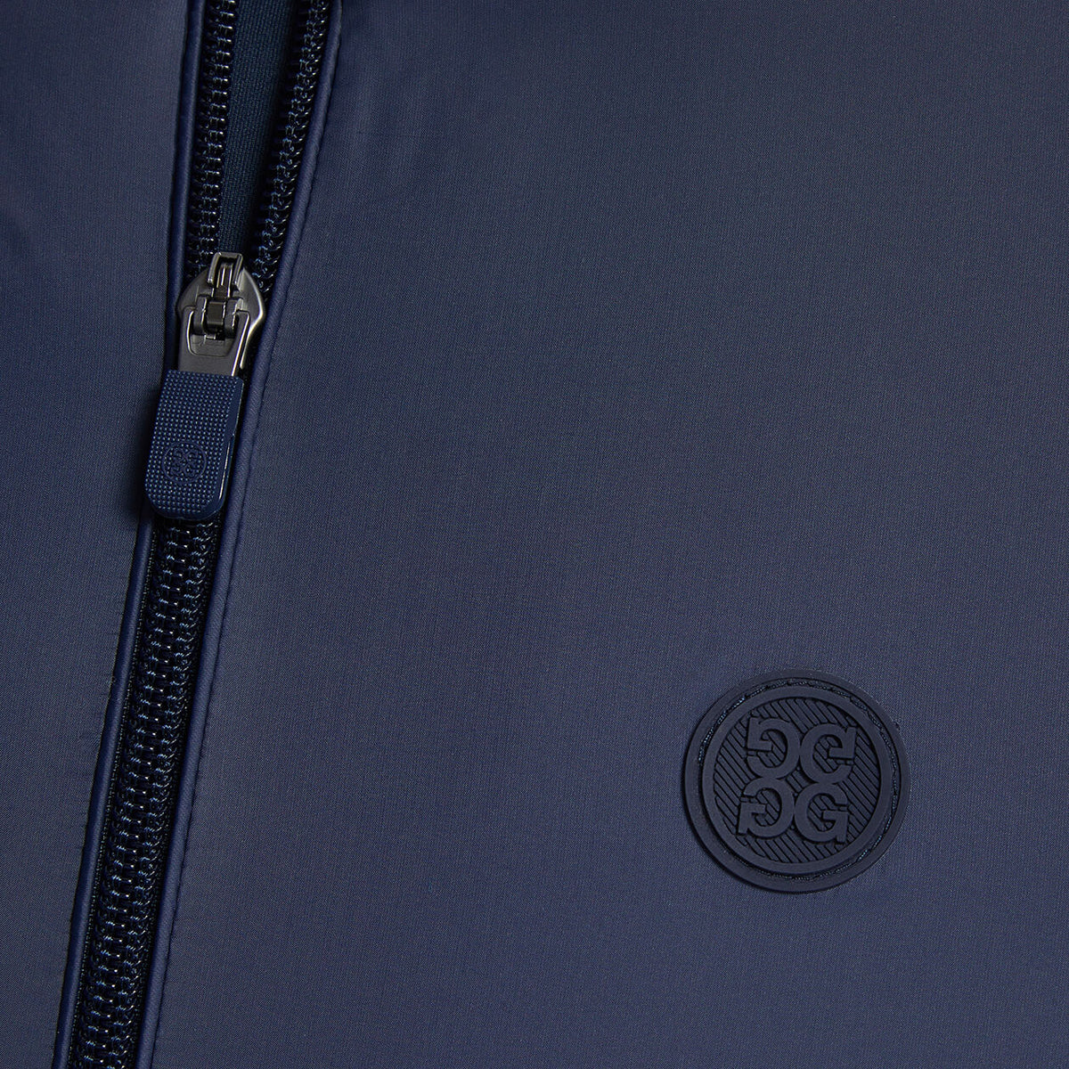 Close up image of the zipper and G/FORE logo